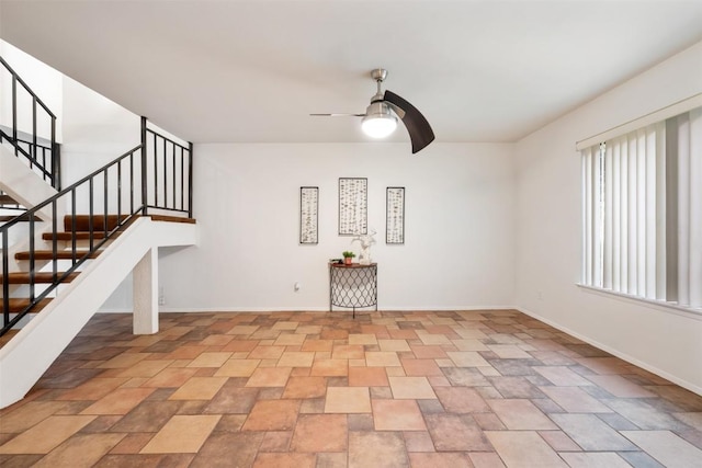 9504 Quail Village Ln, Austin, TX 78758 - empty room with ceiling fan, stairs, and light stone finish floors