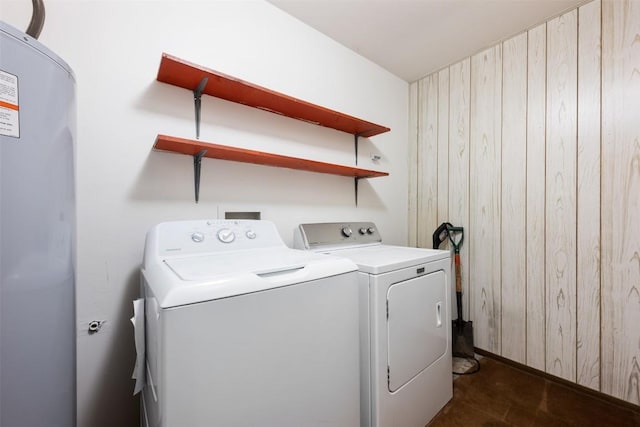 9504 Quail Village Ln, Austin, TX 78758 - laundry room featuring separate washer and dryer and wood walls
