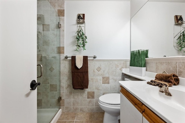 9504 Quail Village Ln, Austin, TX 78758 - full bath featuring vanity, a shower stall, tile walls, and tile patterned floors