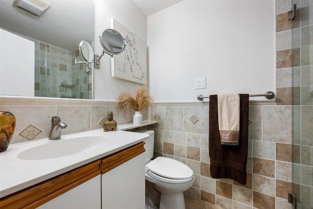 9504 Quail Village Ln, Austin, TX 78758 - bathroom with vanity, tile walls, and tiled shower