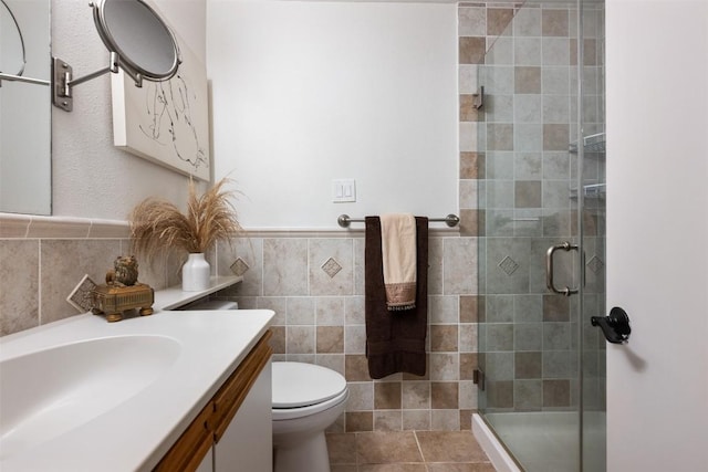 9504 Quail Village Ln, Austin, TX 78758 - full bath with vanity, a stall shower, and tile walls