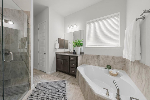 full bathroom featuring a shower stall, vanity, and a bath
