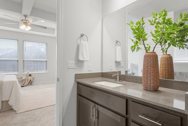 bathroom with vanity, a ceiling fan, and a healthy amount of sunlight