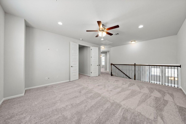 interior space with visible vents, baseboards, a ceiling fan, recessed lighting, and carpet flooring