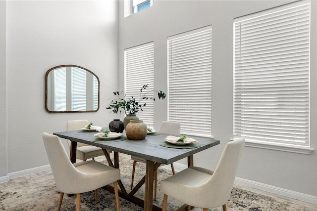 dining area featuring baseboards