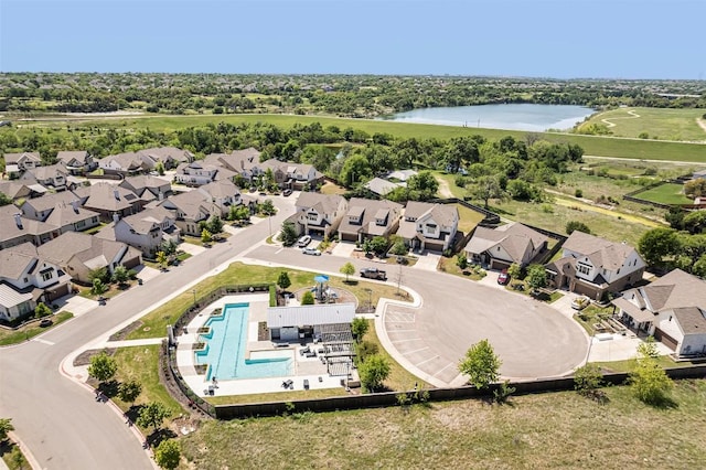 bird's eye view featuring a residential view and a water view
