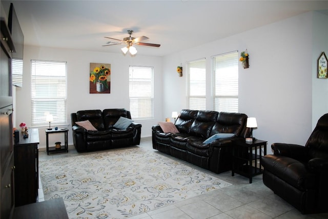 tiled living room with a ceiling fan