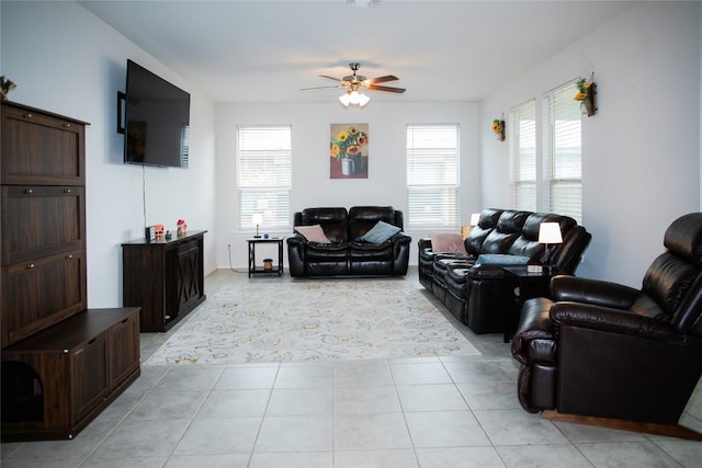 living room featuring ceiling fan, visible vents, and light tile patterned floors