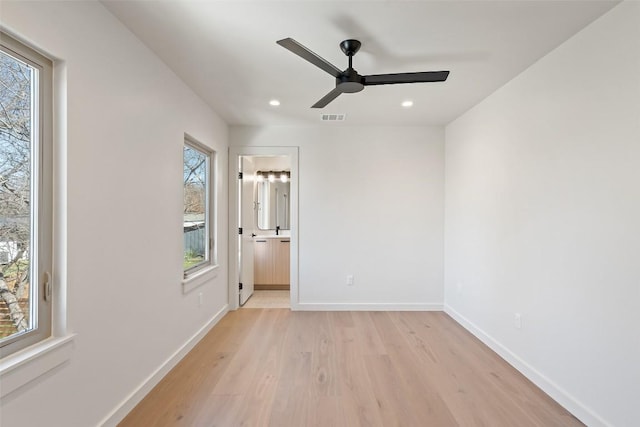 unfurnished room featuring ceiling fan, light wood-style flooring, recessed lighting, visible vents, and baseboards