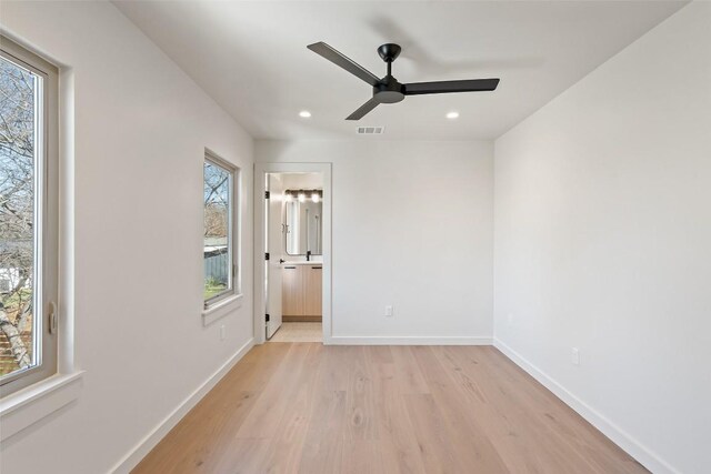 2912 Pecan Springs Rd, Austin, TX 78723 - empty room with light wood-type flooring, healthy amount of natural light, recessed lighting, and ceiling fan