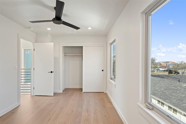 2912 Pecan Springs Rd, Austin, TX 78723 - unfurnished bedroom featuring light wood finished floors, recessed lighting, a closet, and ceiling fan