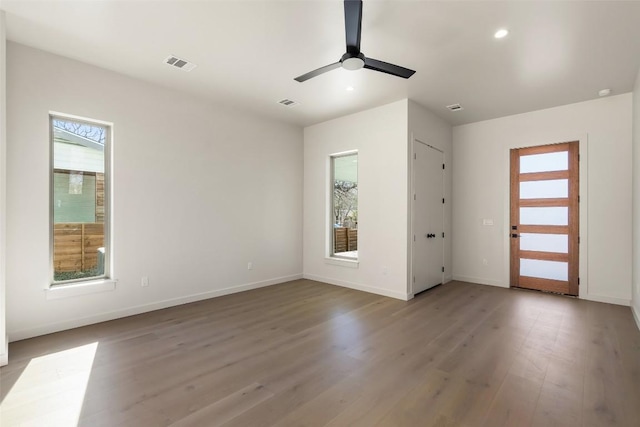 interior space featuring light wood finished floors, recessed lighting, visible vents, ceiling fan, and baseboards