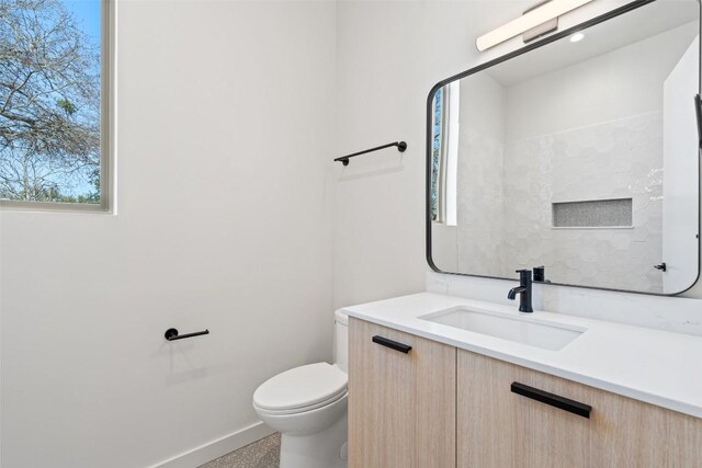 2912 Pecan Springs Rd, Austin, TX 78723 - bathroom featuring vanity and toilet