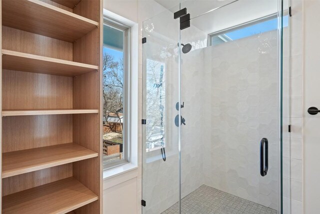 full bath featuring a shower stall