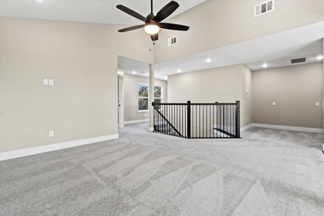 17503 Panorama Dr, Dripping Springs, TX 78620 - empty room with baseboards, carpet, a ceiling fan, recessed lighting, and a high ceiling