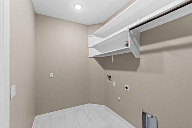 17503 Panorama Dr, Dripping Springs, TX 78620 - washroom featuring hookup for an electric dryer, hookup for a gas dryer, baseboards, and marble finish floors