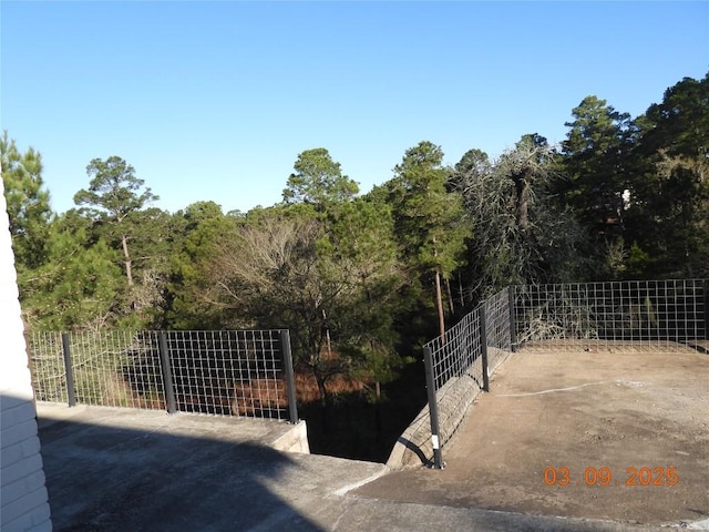 view of gate featuring fence