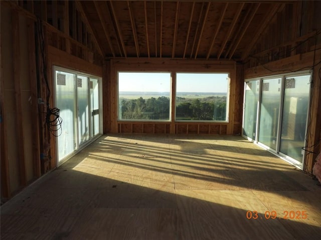 unfurnished sunroom with vaulted ceiling