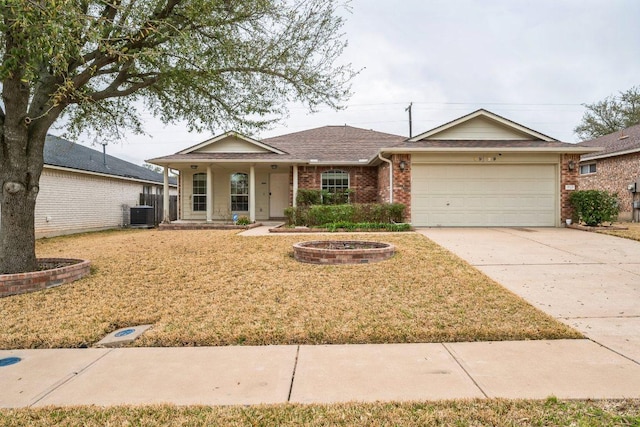 view of front of property featuring central AC, concrete driveway, a front yard, a garage, and brick siding