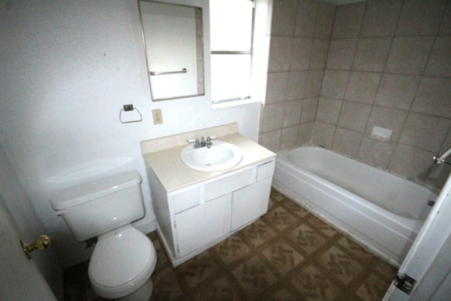 full bathroom featuring vanity and toilet