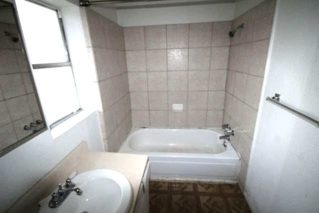 bathroom with shower / washtub combination and vanity