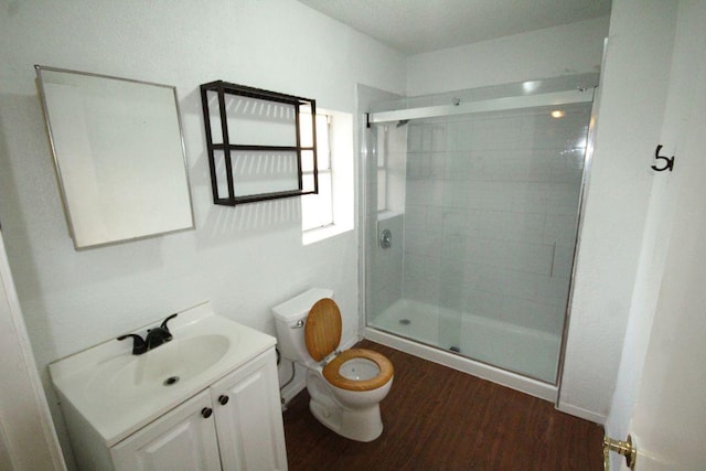 5204 Guadalupe St, Austin, TX 78751 - full bath featuring a shower stall, vanity, and wood finished floors