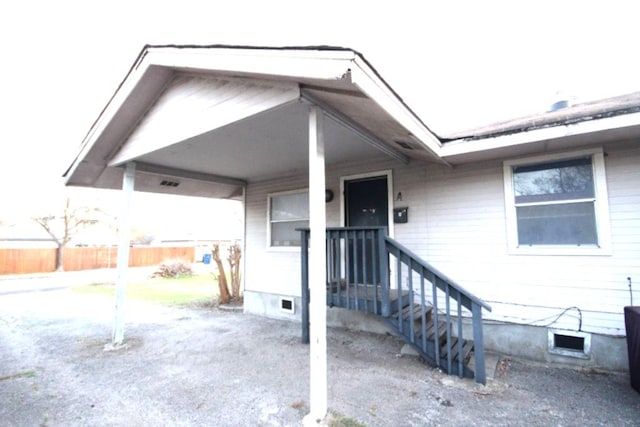 property entrance featuring fence