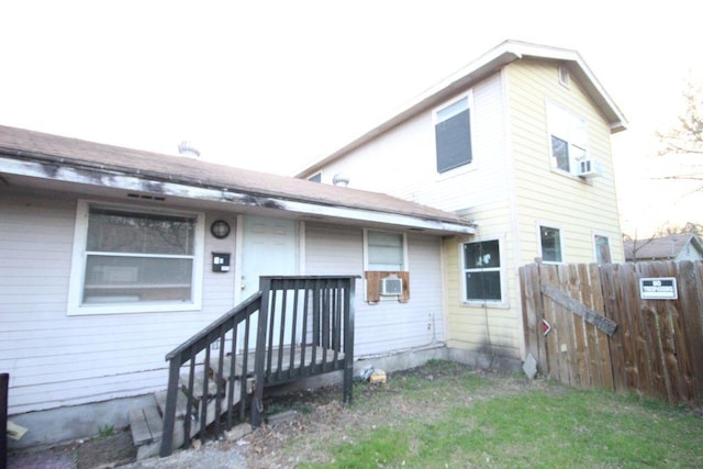 back of house featuring fence