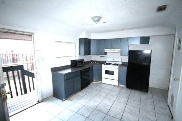 kitchen with visible vents, dark countertops, under cabinet range hood, black appliances, and light tile patterned flooring