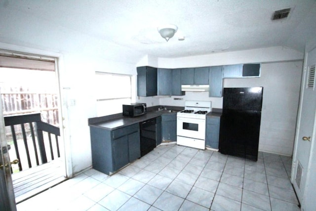 5204 Guadalupe St, Austin, TX 78751 - kitchen with black appliances, dark countertops, and under cabinet range hood