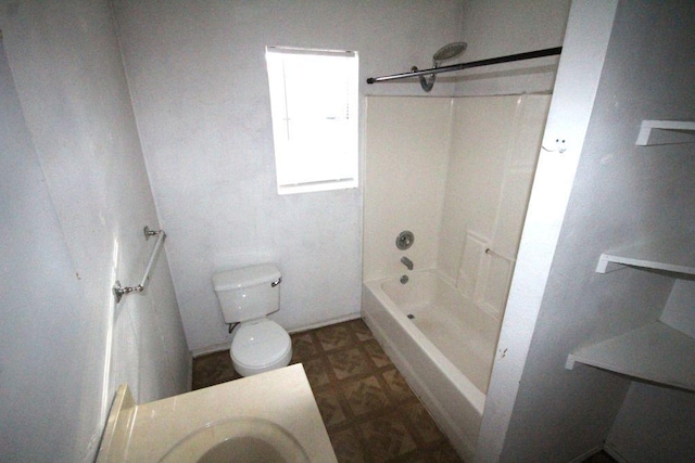 full bathroom featuring toilet, a sink, and shower / bathtub combination