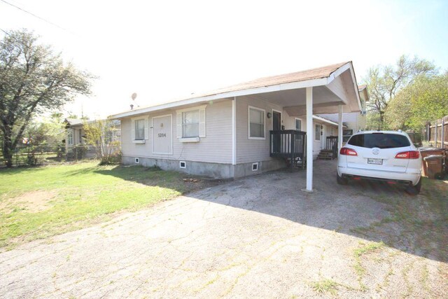 5204 Guadalupe St, Austin, TX 78751 - manufactured / mobile home featuring driveway and a carport