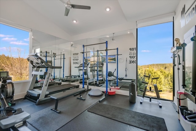 workout area with expansive windows, recessed lighting, baseboards, and ceiling fan