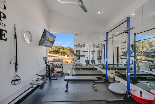 exercise room with baseboards, plenty of natural light, a ceiling fan, and lofted ceiling