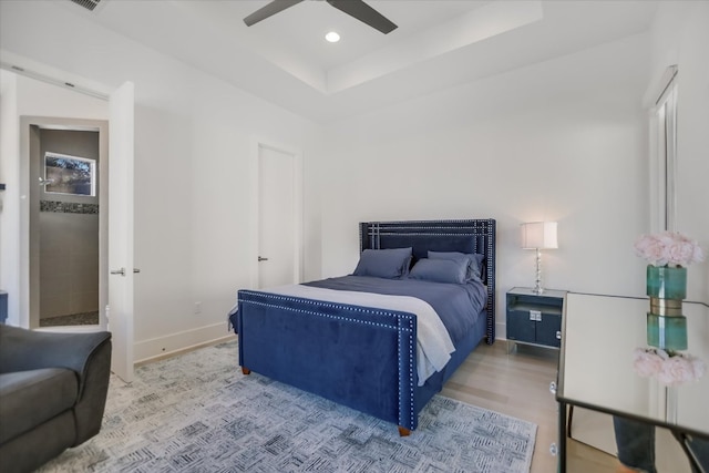 bedroom featuring visible vents, baseboards, ceiling fan, recessed lighting, and a raised ceiling