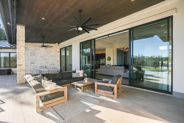 view of patio featuring a ceiling fan and outdoor lounge area