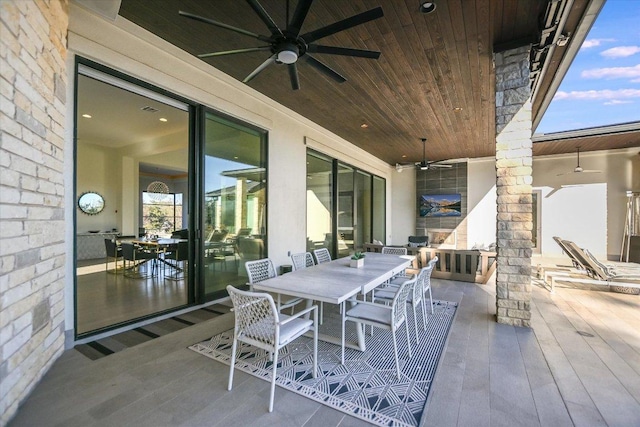 view of patio featuring outdoor dining area and ceiling fan