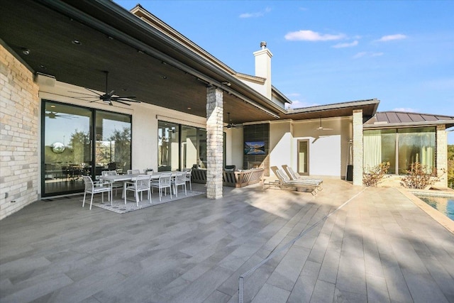 view of patio / terrace with outdoor dining space and a ceiling fan