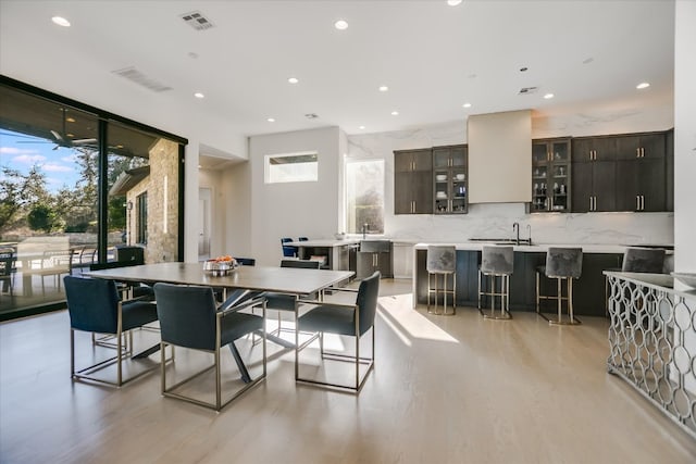 dining room with recessed lighting, visible vents, and light wood-style flooring