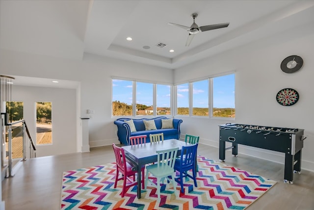 rec room featuring a ceiling fan, visible vents, baseboards, a tray ceiling, and recessed lighting