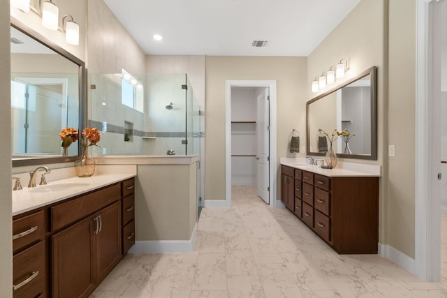 full bathroom featuring a stall shower, visible vents, a sink, marble finish floor, and two vanities