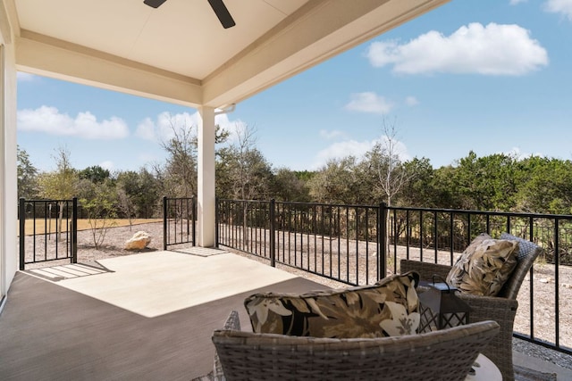 exterior space with a patio area, an outdoor living space, and a ceiling fan