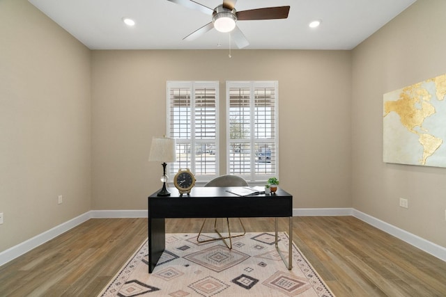 home office with light wood-type flooring, baseboards, and recessed lighting