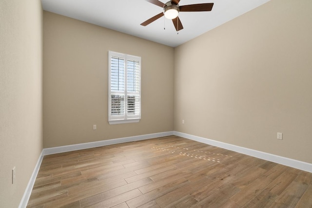 unfurnished room featuring light wood finished floors and baseboards