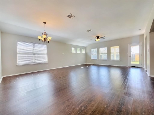 empty room with dark wood-type flooring, visible vents, and baseboards