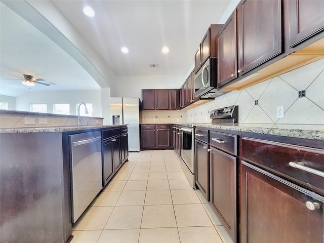 kitchen with visible vents, decorative backsplash, appliances with stainless steel finishes, light tile patterned flooring, and recessed lighting