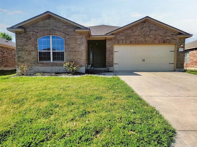 ranch-style home with a garage, brick siding, driveway, roof with shingles, and a front yard