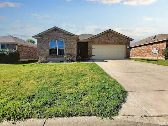 ranch-style house with a front yard, concrete driveway, brick siding, and an attached garage