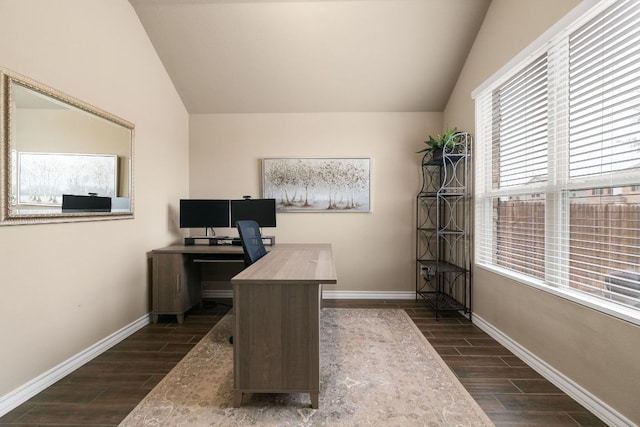 home office with baseboards, vaulted ceiling, and wood finish floors