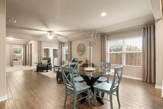 dining area with visible vents, ceiling fan, baseboards, and wood finished floors